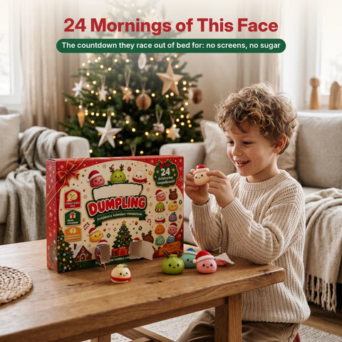 Boy opening a door of the squishy dumpling advent calendar on Christmas morning