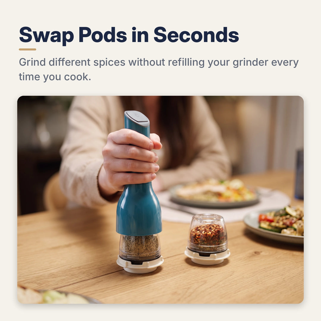 Hand clicking the blue spice mill onto a spice pod