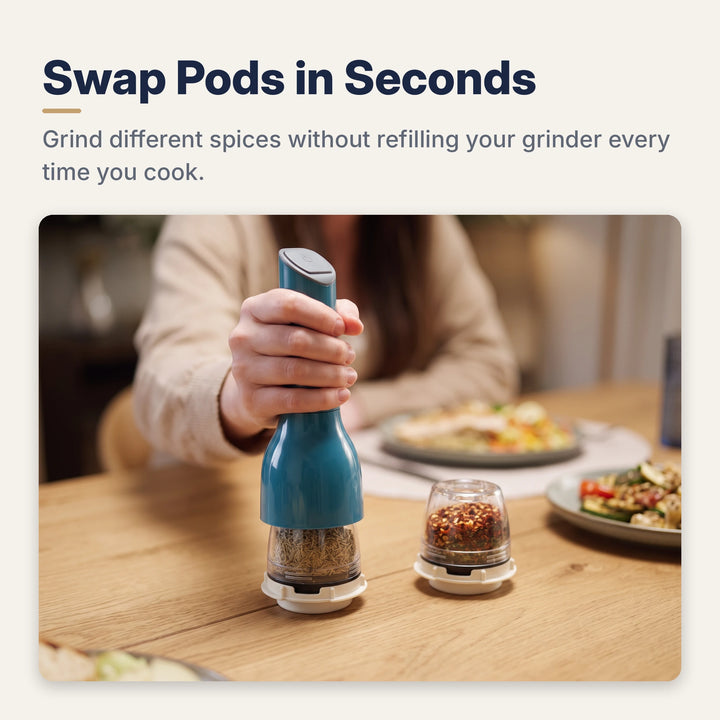 Hand clicking the blue spice mill onto a spice pod