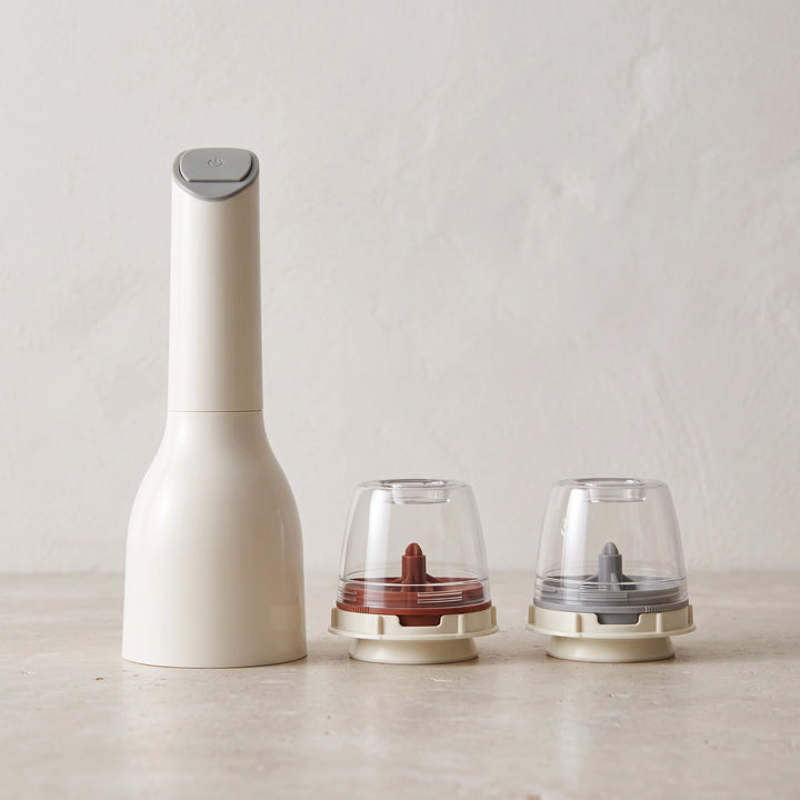 White electric spice mill with two empty pods