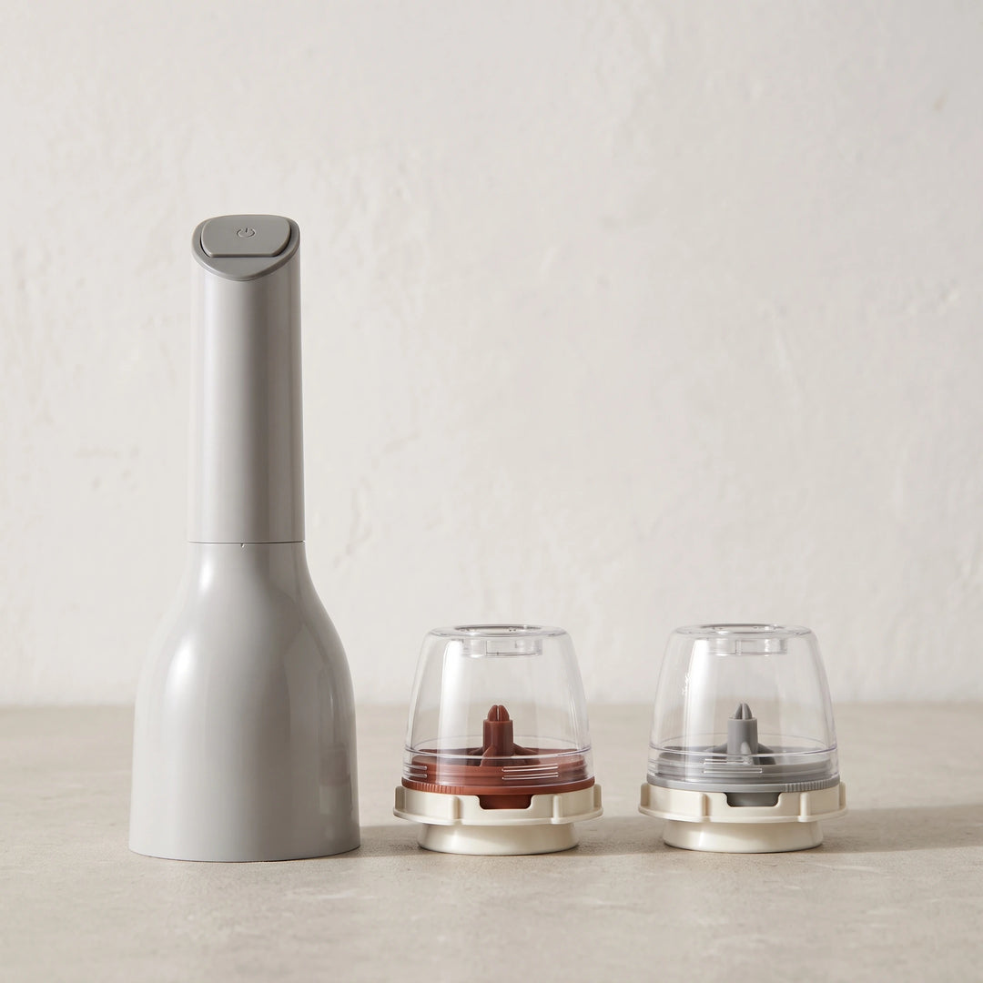 Grey electric spice mill with two empty pods