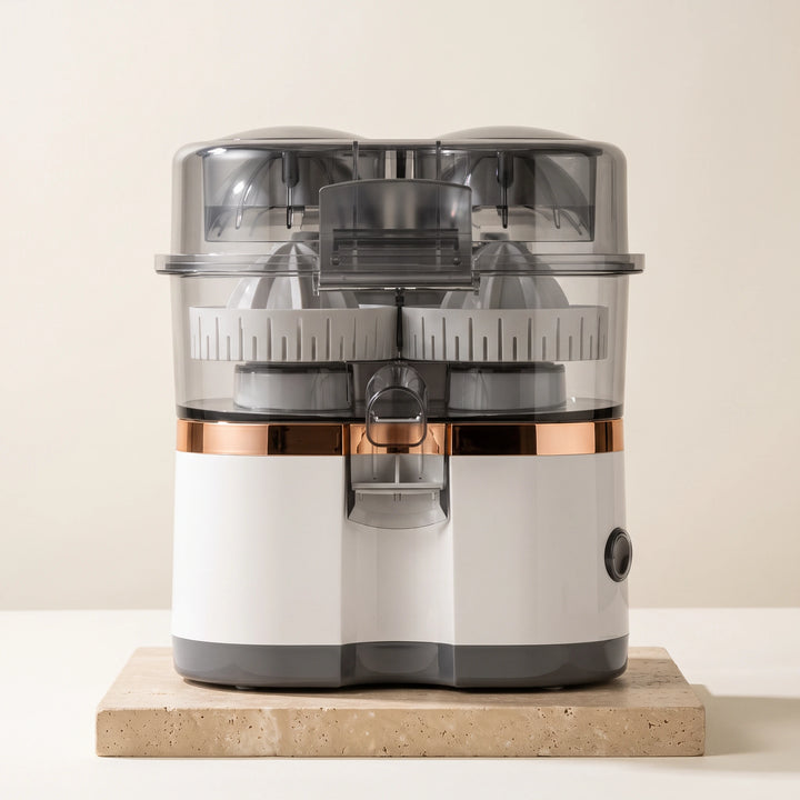 White dual-head electric citrus juicer with clear lid and copper band