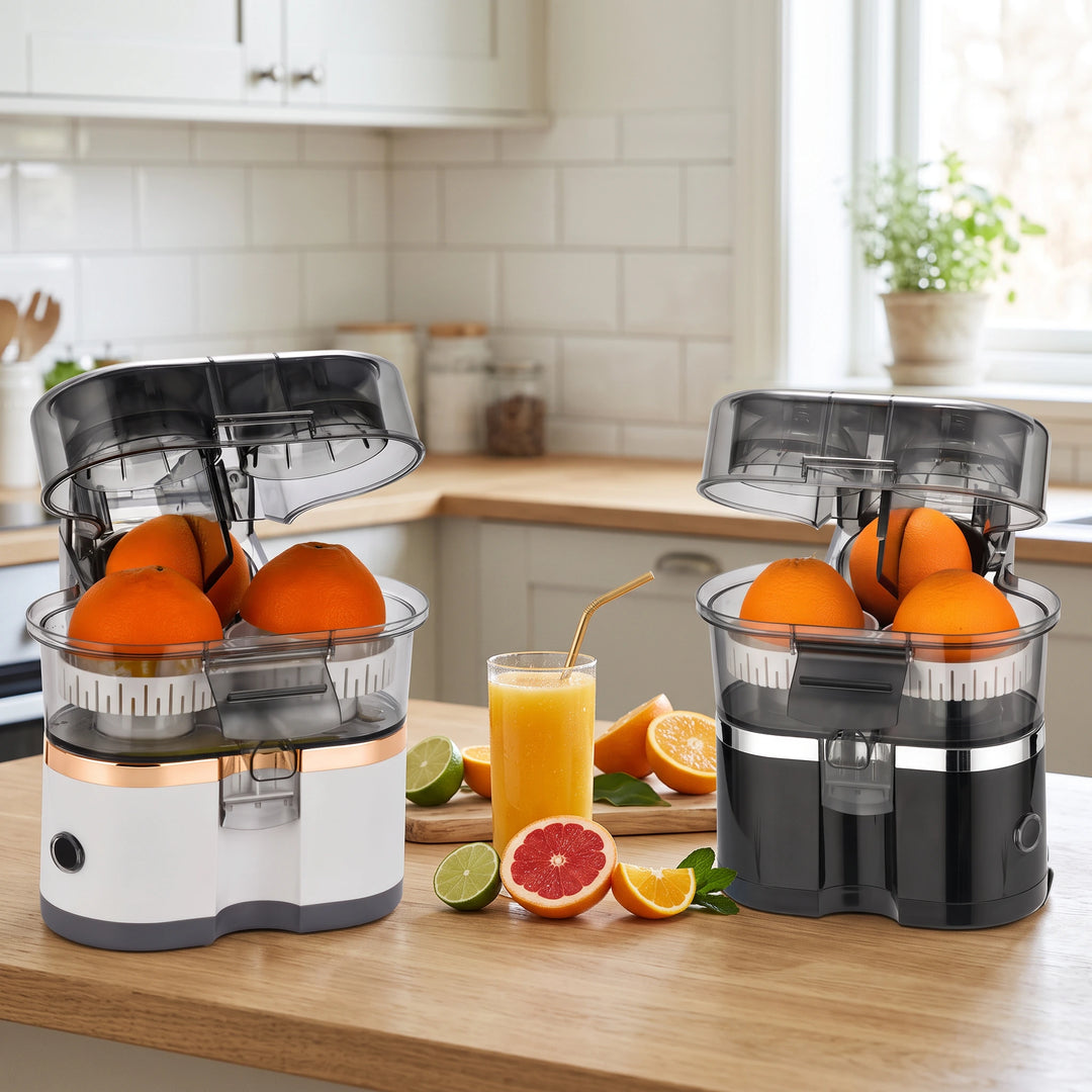 White and black citrus juicers with open lids and orange halves on the reamers