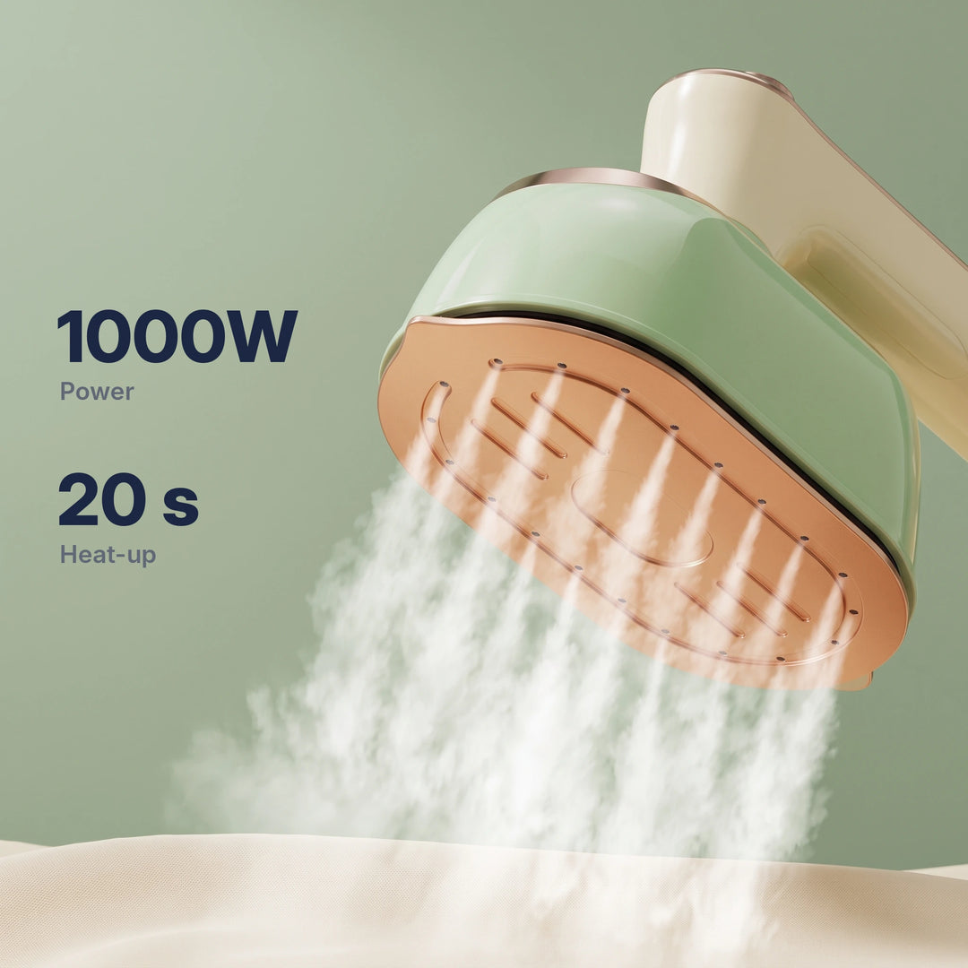 Steam bursting from the rose-gold soleplate of the green steam iron