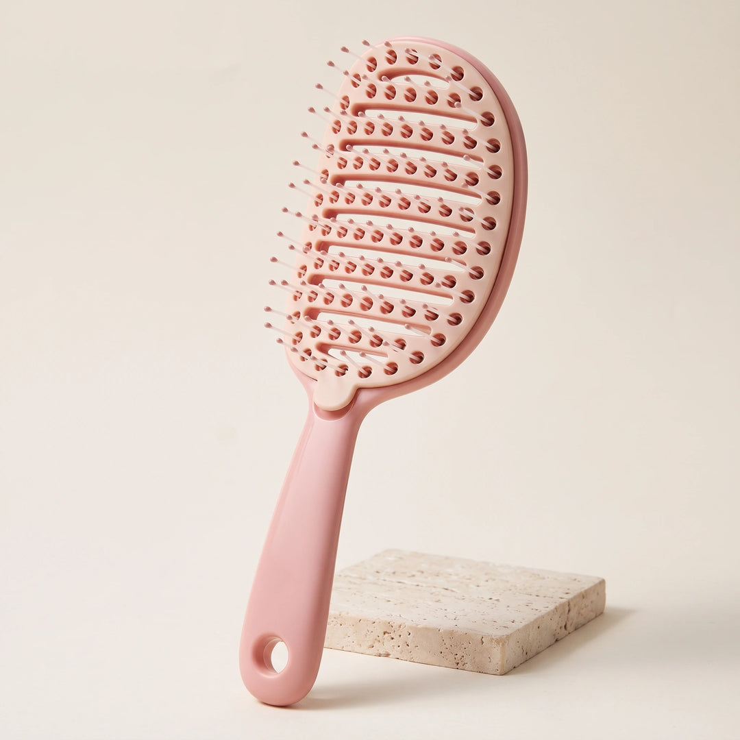 Ribbed comb with removable comb pad in peach pink