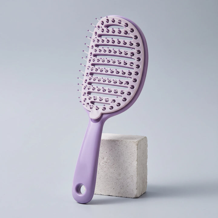 Ribbed comb with removable comb pad in taro purple